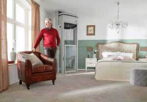 Main standing in living room near home lift