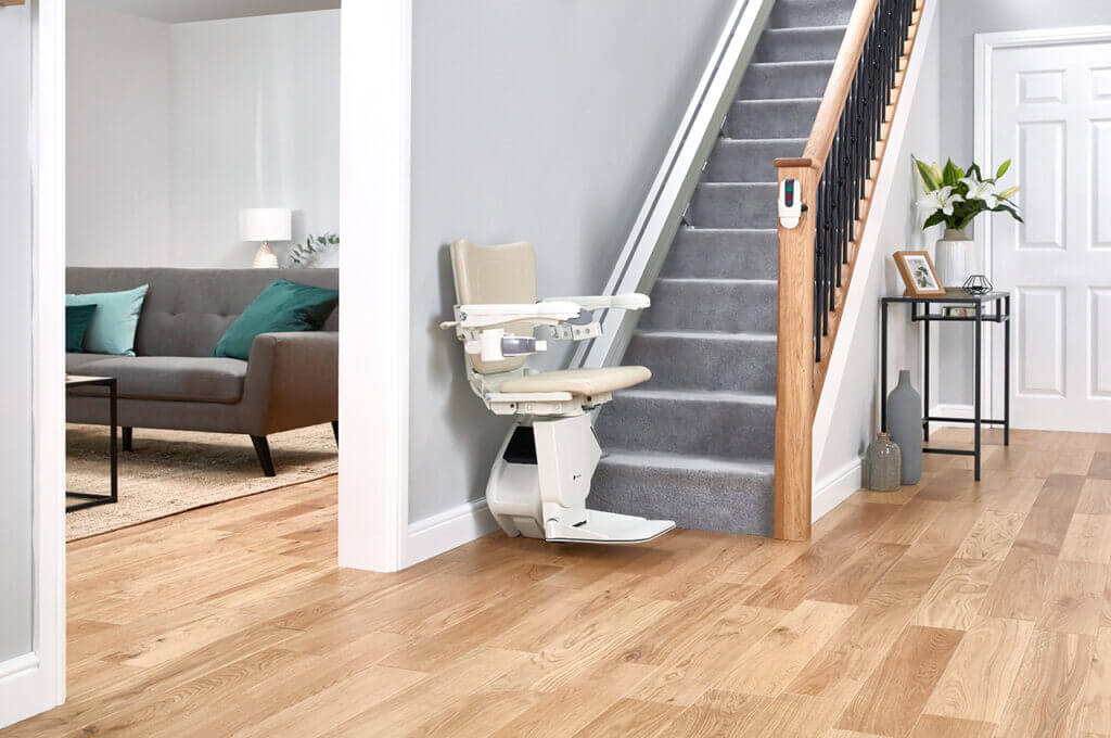 1100 model stairlift at bottom of the stairs