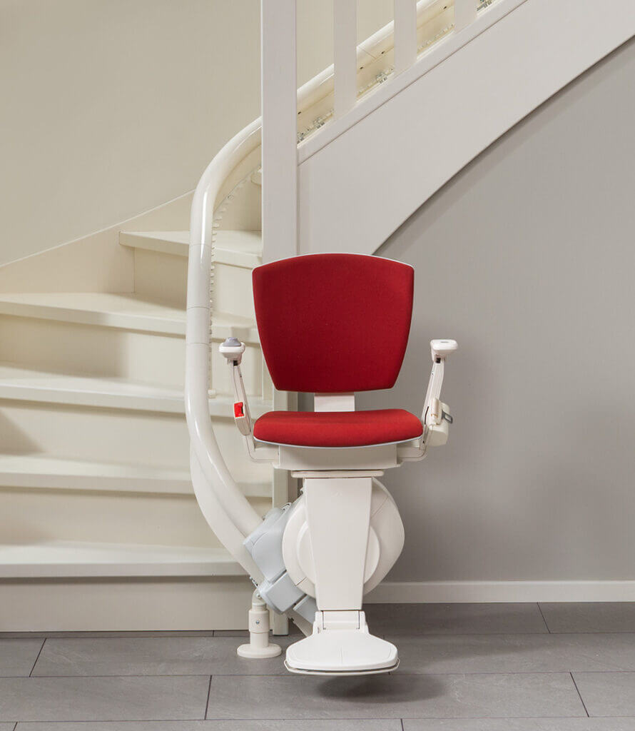 Curved stairlift at the bottom of the stairs - static