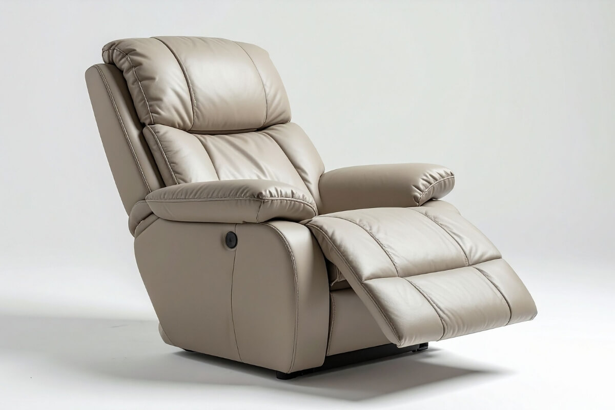 A light beige leather electric recliner armchair displayed with its footrest partially extended on a plain white background.