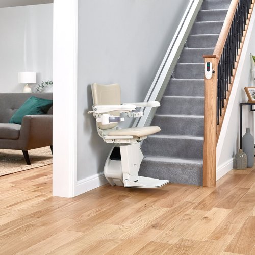 1100 model stairlift at bottom of the stairs